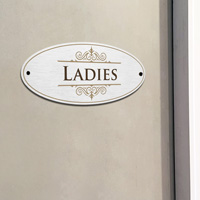 Industrial-style ladies restroom sign