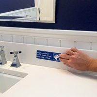 Employees must wash hands before returning to work bathroom sign